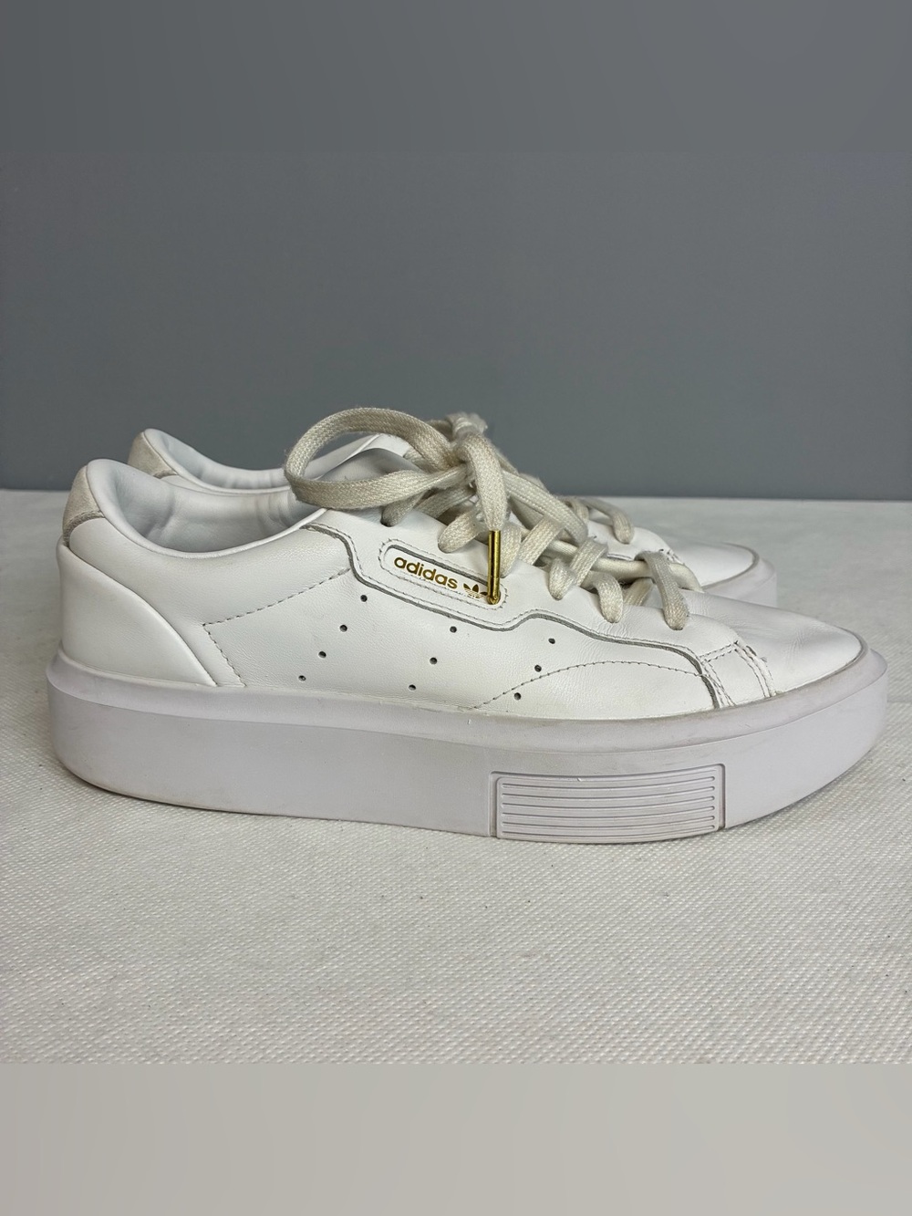 adidas Women’s White Leather Platform Sneakers with Gold Accent